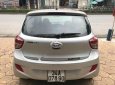 Hyundai i10 1.0MT Base 2014 - Cần bán gấp Hyundai i10 1.0MT Base 2014, màu bạc chính chủ