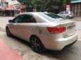 Kia Forte 1.6MT 2010 - Cần bán Kia Forte 1.6MT đời 2010, màu kem (be), giá tốt