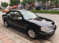 Ford Laser GHIA 1.8 AT 2003 - Cần bán Ford Laser GHIA 1.8 AT đời 2003, màu đen số tự động