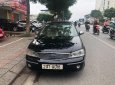 Ford Laser GHIA 1.8 AT 2003 - Cần bán Ford Laser GHIA 1.8 AT đời 2003, màu đen số tự động