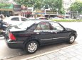 Ford Laser GHIA 1.8 AT 2003 - Cần bán Ford Laser GHIA 1.8 AT đời 2003, màu đen số tự động