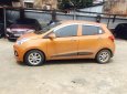 Hyundai Grand i10 1.2 AT 2016 - Cần bán xe Hyundai Grand i10 1.2 AT sản xuất năm 2016, màu cam, nhập khẩu nguyên chiếc, giá tốt