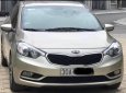 Kia K3 2014 - Cần bán xe Kia K3 đời 2014, màu vàng, 370tr