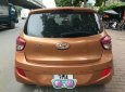 Hyundai Grand i10 1.2AT 2015 - Bán ô tô Hyundai Grand i10 1.2AT sản xuất 2015, màu cam, xe nhập đi giữ gìn