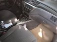 Mitsubishi Lancer 1.6 2004 - Cần bán Mitsubishi Lancer 1.6 năm 2004, màu vàng