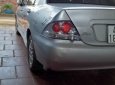 Mitsubishi Lancer 2004 - Cần bán xe cũ Mitsubishi Lancer năm sản xuất 2004, màu bạc xe gia đình