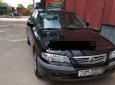 Mazda 626 2.0 MT 2001 - Cần bán lại xe Mazda 626 2.0 MT 2001, màu đen số sàn giá cạnh tranh