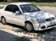 Daewoo Lanos SX 2004 - Cần bán xe Daewoo Lanos SX sản xuất 2004, màu trắng 