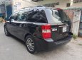 Kia Carnival 2.7 MT 2010 - Bán Kia Carnival 2.7 MT năm 2010, màu đen, nhập khẩu nguyên chiếc  