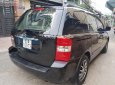 Kia Carnival 2.7 MT 2010 - Bán Kia Carnival 2.7 MT năm 2010, màu đen, nhập khẩu nguyên chiếc  