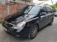 Kia Carnival 2.7 MT 2010 - Bán Kia Carnival 2.7 MT năm 2010, màu đen, nhập khẩu nguyên chiếc  