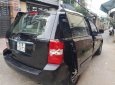 Kia Carnival 2.7 MT 2010 - Bán Kia Carnival 2.7 MT năm 2010, màu đen, nhập khẩu nguyên chiếc  