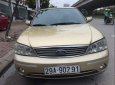 Ford Laser GHIA 1.8 AT 2004 - Bán ô tô Ford Laser GHIA 1.8 AT đời 2004, màu vàng, 230 triệu