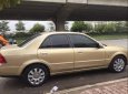 Ford Laser GHIA 1.8 AT 2004 - Bán ô tô Ford Laser GHIA 1.8 AT đời 2004, màu vàng, 230 triệu