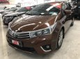 Toyota Corolla altis 1.8G MT 2014 - Bán gấp Toyota Corolla altis 1.8G MT sản xuất 2014, màu nâu số sàn, giá chỉ 620 triệu