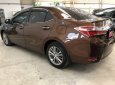 Toyota Corolla altis 1.8G MT 2014 - Bán gấp Toyota Corolla altis 1.8G MT sản xuất 2014, màu nâu số sàn, giá chỉ 620 triệu