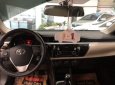 Toyota Corolla altis 1.8G MT 2014 - Bán gấp Toyota Corolla altis 1.8G MT sản xuất 2014, màu nâu số sàn, giá chỉ 620 triệu