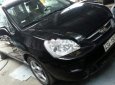 Kia Carens   1.6MT 2010 - Bán xe Kia Carens 1.6MT sản xuất 2010, màu đen số sàn