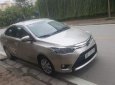 Toyota Vios E 2015 - Chính chủ bán xe Toyota Vios E sản xuất 2015, màu vàng cát