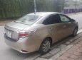 Toyota Vios E 2015 - Chính chủ bán xe Toyota Vios E sản xuất 2015, màu vàng cát