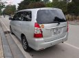 Toyota Innova 2.4 MT 2014 - Cần bán lại xe Toyota Innova 2.4 MT năm 2014, màu bạc  