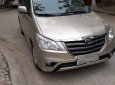 Toyota Innova E 2014 - Bán Toyota Innova E đời 2014, màu vàng cát, còn mới