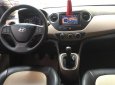 Hyundai Grand i10 1.0MT 2015 - Cần bán lại xe Hyundai Grand i10 1.0MT đời 2015, màu bạc, xe còn mới và nguyên bản toàn bộ