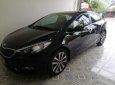 Kia K3 2015 - Gia đình bán xe Kia K3 sản xuất 2015, màu đen