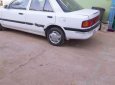 Mazda 323 1.6 MT 1995 - Cần bán Mazda 323 1.6 MT 1995, màu trắng