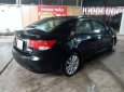 Kia Forte 2010 - Bán Kia Forte đời 2010, màu đen số sàn