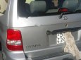 Kia Carnival 2.5 MT 2006 - Cần bán gấp xe Kia Carnival 7 chỗ, Sx 2006, số tay, máy xăng, màu bạ, nội thất màu ghi, đã đi 104000 km