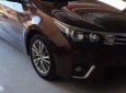 Toyota Corolla altis 1.8G MT 2015 - Bán Toyota Corolla altis 1.8G MT đời 2015, màu nâu, đẹp như mới