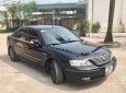 Ford Mondeo 2.5 AT 2004 - Gia đình bán Ford Mondeo 2.5 AT sản xuất năm 2004, màu đen, giá chỉ 210 triệu