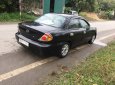 Kia Spectra 2004 - Bán Kia Spectra sản xuất năm 2004, màu đen xe gia đình