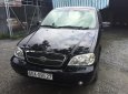 Kia Carnival 2006 - Bán Kia Carnival đời 2006, màu đen, nhập khẩu xe gia đình, giá tốt