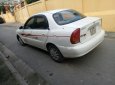 Daewoo Lanos SX 2004 - Gia đình cần bán Daewoo Lanos SX đời 2004, màu trắng, giá 72tr