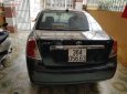 Daewoo Lacetti EX 2005 - Cần bán Daewoo Lacetti Ex đời 2005, màu đen, xe gia đình sử dụng nên rất giữ xe