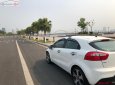 Kia Rio 1.4 AT 2014 - Bán xe Kia Rio nhập khẩu Hàn Quốc đời 2014, số tự động, máy xăng, màu trắng, nội thất màu kem