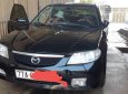 Mazda 323 2004 - Bán ô tô Mazda 323 sản xuất 2004, màu đen chính chủ, giá 145tr