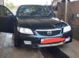 Mazda 323 2004 - Bán ô tô Mazda 323 sản xuất 2004, màu đen chính chủ, giá 145tr