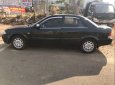 Ford Laser   2001 - Cần bán gấp Ford Laser 2001, màu đen, xe gia đình, 125tr