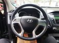 Hyundai Tucson 4WD 2011 - Cần bán xe Hyundai Tucson 4WD sản xuất 2011, màu đen, nhập khẩu nguyên chiếc, giá chỉ 585 triệu