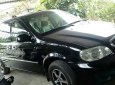 Kia Carnival  MT 2007 - Cần bán lại xe Kia Carnival MT đời 2007, màu đen xe gia đình sử dụng, 7 chỗ