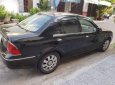 Ford Laser   1.8   2004 - Bán Ford Laser 1.8 đời 2004, màu đen, số tự động 