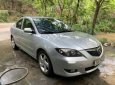 Mazda 3 AT 2004 - Cần bán lại xe Mazda 3 AT sản xuất năm 2004, màu bạc