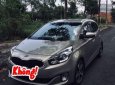 Kia Rondo 2016 - Bán ô tô Kia Rondo sản xuất 2016, màu vàng cát