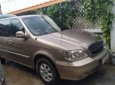 Kia Carnival  GS   2009 - Cần bán lại xe Kia Carnival GS sản xuất 2009, màu nâu, xe nhập