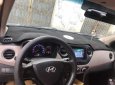 Hyundai Grand i10   2015 - Gia đình bán Hyundai Grand i10 sản xuất 2015, màu bạc, nhập khẩu nguyên chiếc