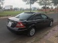 Ford Mondeo   2V  2006 - Bán Ford Mondeo 2V đời 2006, màu đen, xe đang sử dụng không lội nước và cấn mốp