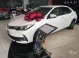 Toyota Corolla altis  1.8E  2019 - Cần bán xe Toyota Corolla Altis 1.8E 2019, màu trắng, 733 triệu